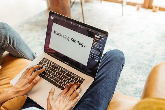 a laptop that says on screen marketing strategy